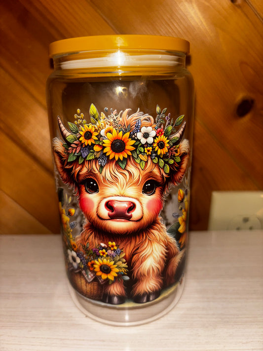 Baby highland cow with sunflowers